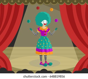 female clown juggler with balls on theater stage