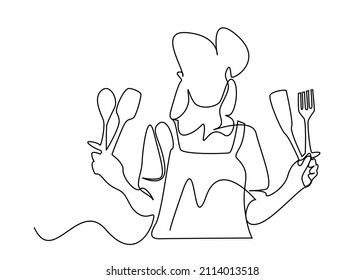female cook posing holding kitchen supplies