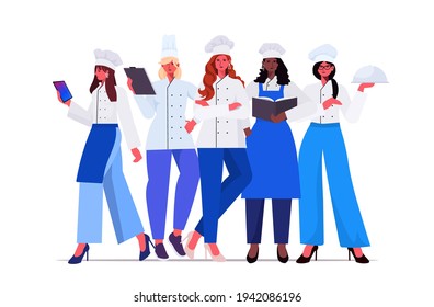 female cooks in uniform standing together beautiful women chefs cooking food industry concept