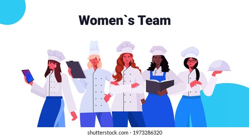 female cooks in uniform standing together beautiful women chefs cooking food industry concept