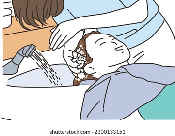 A female customer being shampooed at a beauty salon
