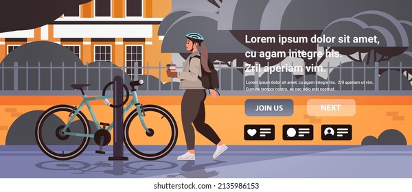 female cyclist taking break during bike ride woman in helmet with takeaway coffee cup standing near bicycle