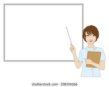 A female dental assistant holding a pointer in front of a whiteboard