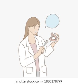 Female dentist demonstrating brushing teeth on tooth model. Dental concept. Vector illustration.