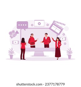  Female director talking with the assistant while watching a movie scene on the TV screen. Film Production Concept. trend modern vector flat illustration