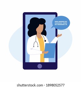 A female doctor conducts an online consultation via a smartphone. The family doctor is on the phone. Remote medical consultation.