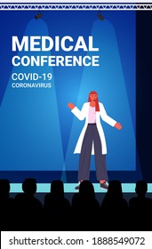 Female Doctor Giving Speech On Medical Conference Coronavirus Pandemic Medicine Healthcare Concept Lecture Hall Interior Vertical Vector Illustration