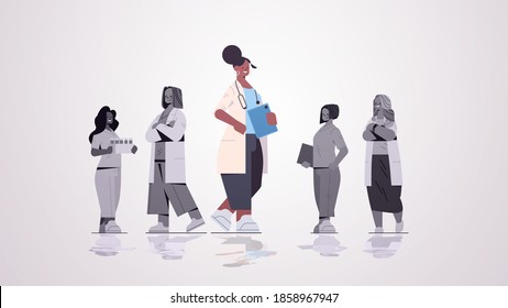 Female Doctor Leader Standing In Front Of Medical Professionals Team In Uniform Medicine Healthcare Concept Horizontal Full Length Vector Illustration