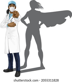 A female doctor super hero woman with stethoscope and mask PPE. Pointing in a your country needs or wants you gesture.  Revealed as a superhero by the shape of her shadow.