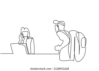 female employee checking incoming customer in front of a reception desk