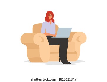 female employee typing laptop while sitting on a single sofa