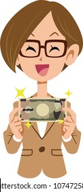 Female employee who rejoices with paper money