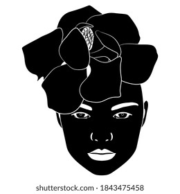 Female face with magnolia flower as hat. Black and white silhouette. Creative concept.