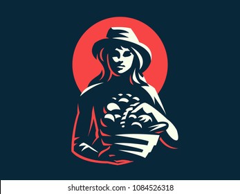 A female farmer in a hat with a basket of vegetables and fruits. Vintage vector logo.