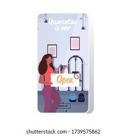 female fitness trainer holding open sign board coronavirus quarantine is ending victory over covid-19 concept gym interior smartphone screen mobile app copy space vector illustration