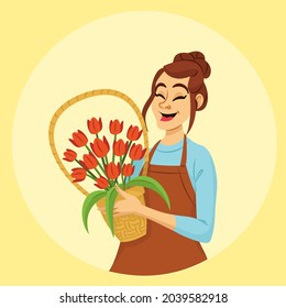 Female florist holding vase of tulips