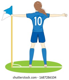 Female football player performing a goal