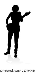 A female guitarist musician in detailed silhouette playing her guitar musical instrument.