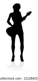 A female guitarist musician in detailed silhouette playing her guitar musical instrument.