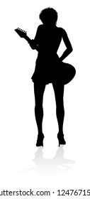 A female guitarist musician in detailed silhouette playing her guitar musical instrument.