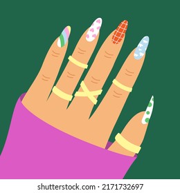Female hand with aesthetic manicured nails, golden ring. Nostalgia for 1990s.
