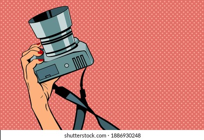 Female hand with a camera. Photographing in the studio. Vector banner illustration in pop art retro style.