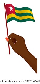 Female hand gently holds small flag of Togolese Republic. Holiday design element. Cartoon vector on white background