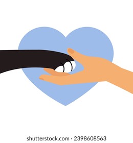 Female hand hold black cat paw. Friendly touch. Side view. Animal and people friendship. Assistance and animal help concept. Heart shape background.