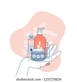  Female hand holding different organic cosmetics. Fashion illustration. Online store. Vector illustration