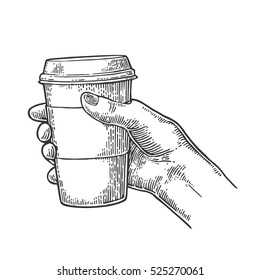 Female hand holding a disposable cup of coffee with cardboard holder and cap. Vintage black vector engraving illustration for label, web, flayer. Isolated on white background