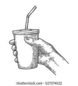 Female hand holding a disposable paper cup cola with straws and cap. Isolated on white background. Vector black engraving illustration for poster, menus, web, banner, icon
