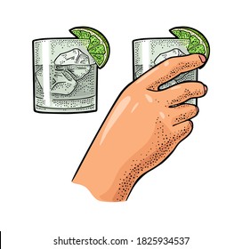 Female hand holding glass cocktail gin with lime and ice cube. Vintage color vector engraving illustration for label, poster, invitation to party. Isolated on white background