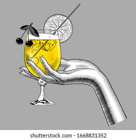 Female hand holding a glass with a fruit cocktail. Vintage color engraving stylized drawing. Vector illustration