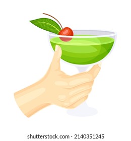 Female hand holding glass of green cocktail vector illustration