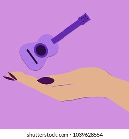 female hand holding the guitar