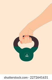 Female hand holding a kettlebell