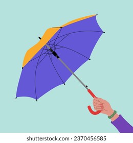 Female hand holding open umbrella. Hand drawn vector illustration isolated on blue background, modern flat cartoon style.