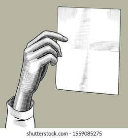 Female hand holding a paper sheet. Vintage engraving stylized drawing. Vector illustration