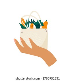 Female Hand Holding Reusable Eco Bag With Organic Vegetables. Zero Waste Concept