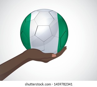 Female hand holding a soccer ball with Nigeria flag color vector image