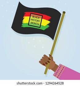 Female hand holding waving Black History Month flag with proud as a celebration on blue gradient background