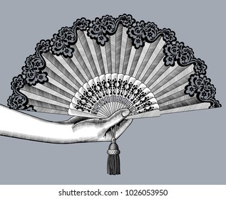 Female hand with open fan. Vintage engraving stylized drawing. Vector illustration