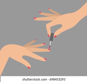 Female hand painting nails or applying nail polish concept