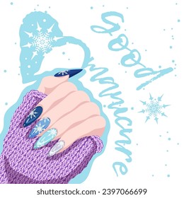 Female hand with winter manicure with snowflakes and a warm knitted sweater. The concept of a beautiful fashionable design on long nails. Modern nail art for the Christmas holidays.