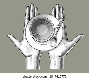 Female hands with a cup of tea and a spoon on the palms. Vintage engraving stylized drawing. Vector illustration