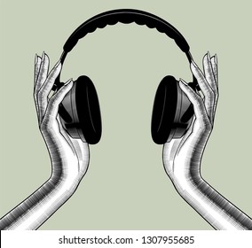 Female hands with headphones. Vintage engraving stylized drawing. Vector illustration