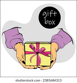 Female hands hold gift box with ribbon and bow. Concept of giving gifts and receiving surprise. Hands hold gift box made of yellow paper with bright pink bow made of satin ribbon.