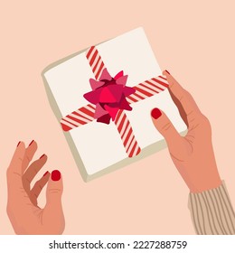 Female hands holding a gift box vector illustration.
