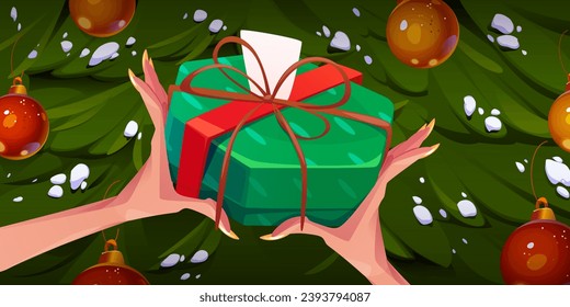 Female hands holding gift box on Christmas tree background. Vector cartoon illustration of merry Xmas present, surprise package wrapped in green paper with red ribbon bow, blank card, winter holidays