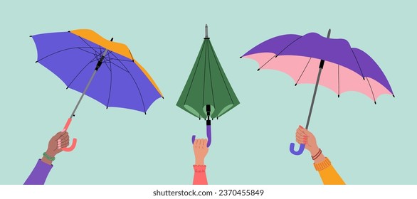 Female hands holding open and closed umbrellas. Hand drawn vector illustration isolated on blue background. Flat cartoon style.